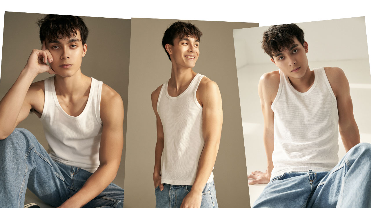 model-robin-van-den-akker-blogpost-dark-brown-hair-muscle-tank-top-blue-jeans-smile-cute-beige-background-pretty-face